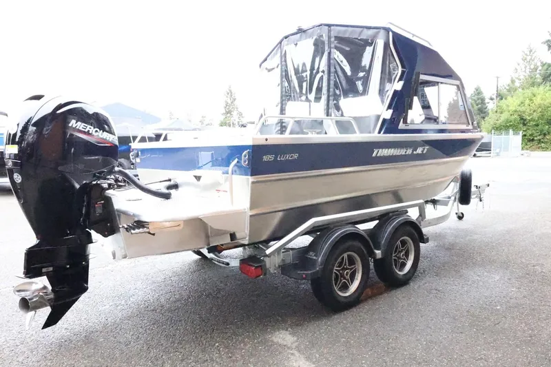 Slide: The Image of 2026 Thunder Jet 185 Luxor boat on trailer with Mercury outboard motor. - 6