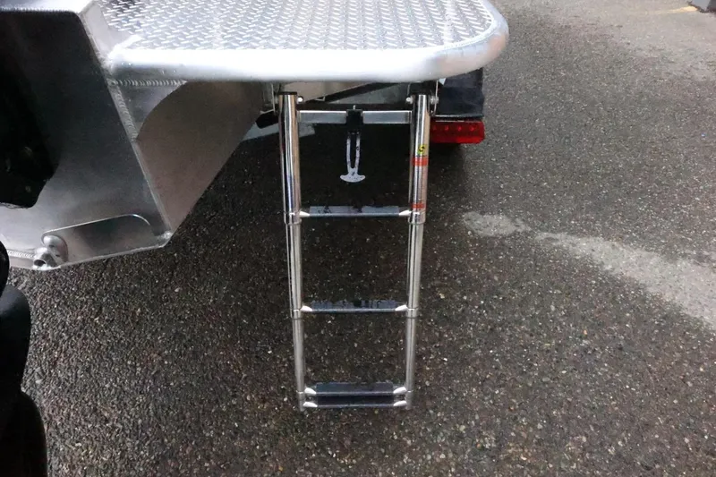 Slide: The Image of 2026 Thunder Jet 185 Luxor boat ladder on textured metal platform. - 9