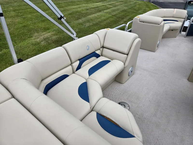 Slide: The Image of 2014 Lowe SS230 Super Sport boat interior with beige and blue seating. - 19