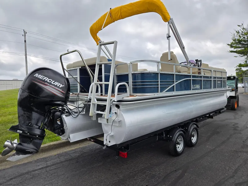 Slide: The Image of 2014 Lowe SS230 Super Sport pontoon boat with Mercury outboard motor on trailer. - 3