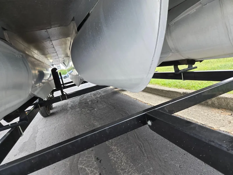 Slide: The Image of Underneath view of a 2014 Lowe SS230 Super Sport pontoon boat on a trailer. - 7