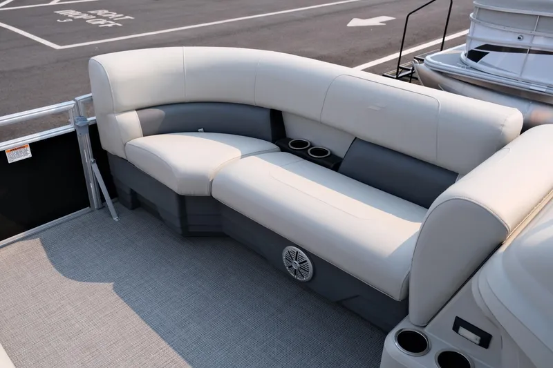 Slide: The Image of 2023 Starcraft LX 18 R boat interior with plush seating and cup holders. - 17