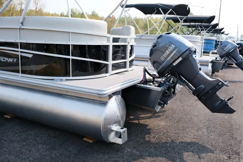 Slide: The Image of 2023 Starcraft LX 18 R pontoon boat with Yamaha outboard motor on display. - 6