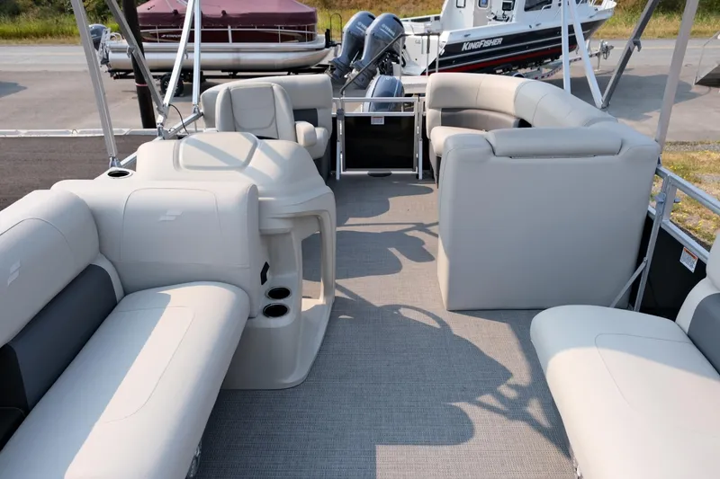 Slide: The Image of 2023 Starcraft LX 18 R pontoon boat interior with spacious seating and modern design. - 8