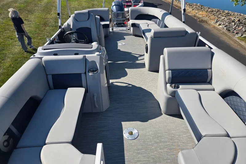 Slide: The Image of 2022 Bennington L 22 Quad Bench pontoon boat interior with spacious seating and modern design. - 12