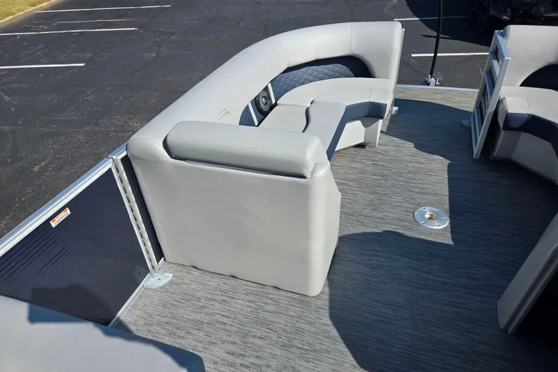 Slide: The Image of 2022 Bennington L 22 Quad Bench interior with gray seating and spacious layout. - 21