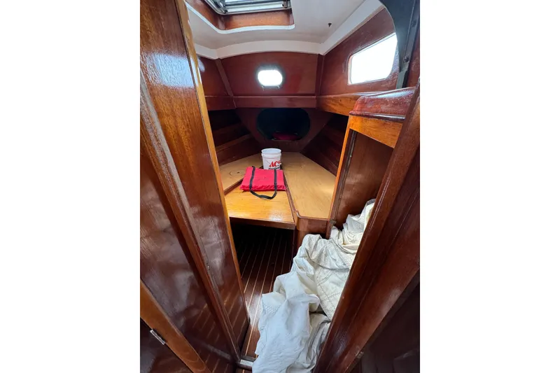 Slide: The Image of Interior of 1960 Alden Challenger 38 sailboat with wooden finish and cozy cabin space. - 16