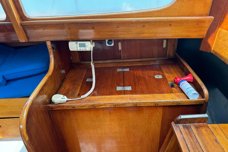 Slide: The Image of Interior of 1960 Alden Challenger 38 sailboat with wooden cabinetry and communication equipment. - 18