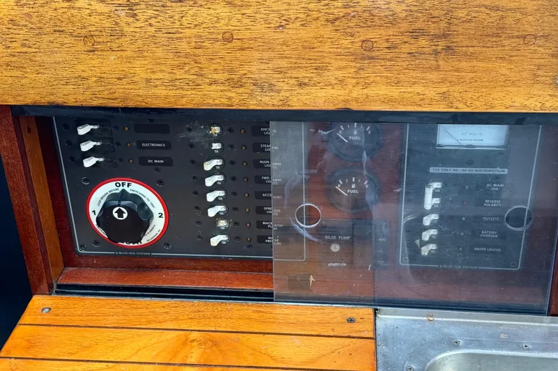 Slide: The Image of Control panel of a 1960 Alden Challenger 38 sailboat with switches and gauges. - 20