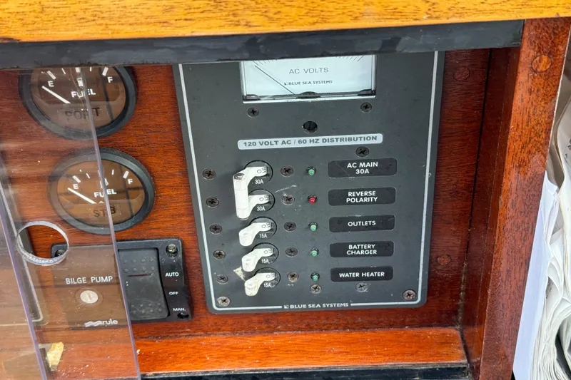 Slide: The Image of Electrical panel of 1960 Alden Challenger 38 boat with gauges and switches. - 21