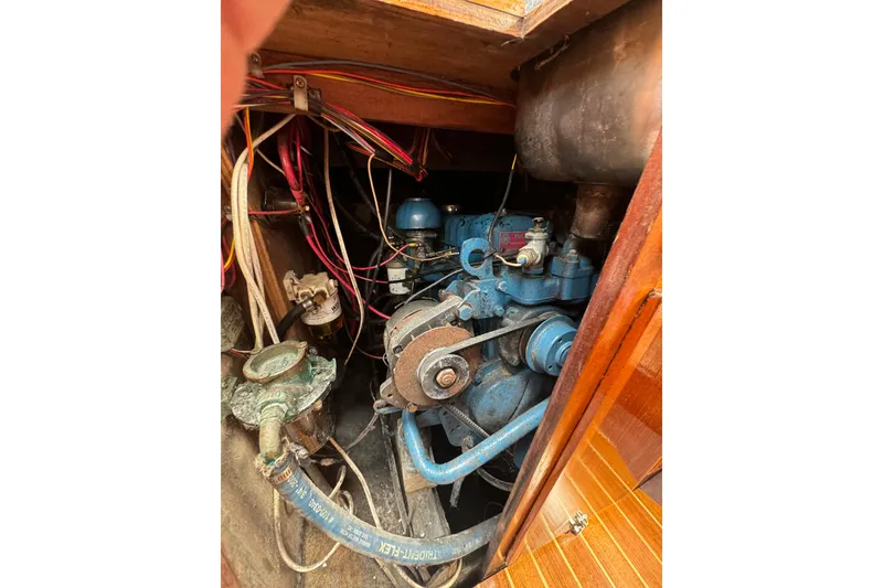 Slide: The Image of 1960 Alden Challenger 38 engine compartment with visible wiring and components. - 23