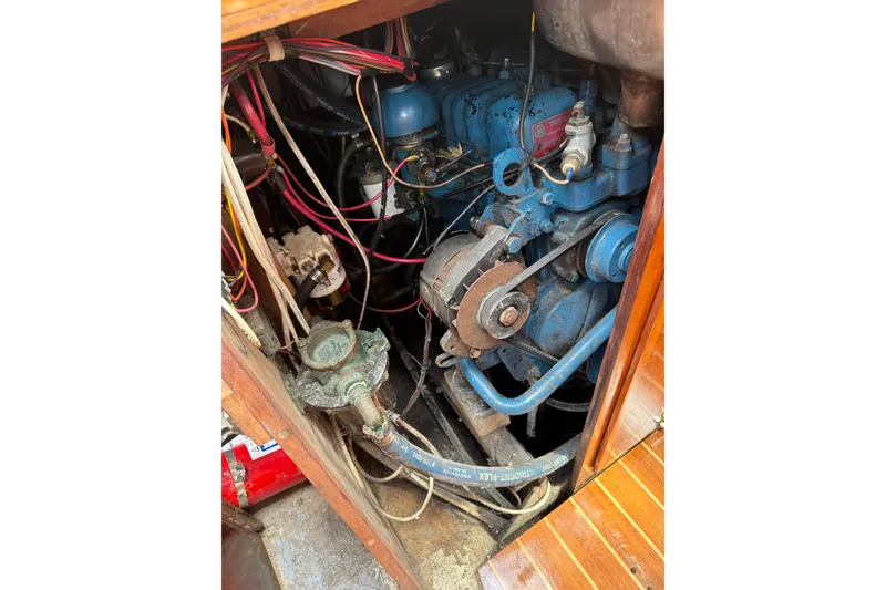 Slide: The Image of 1960 Alden Challenger 38 engine compartment with visible wiring and components. - 24