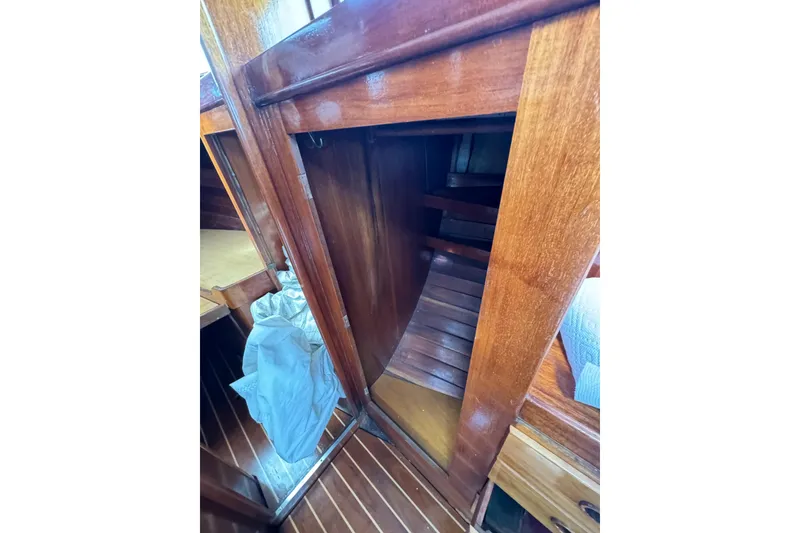 Slide: The Image of Interior view of 1960 Alden Challenger 38 sailboat with wooden cabinetry and flooring. - 26