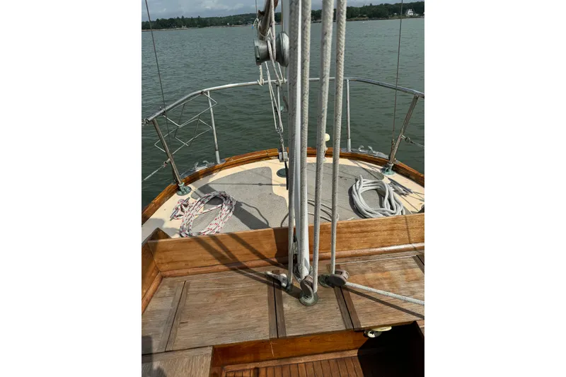 Slide: The Image of 1960 Alden Challenger 38 sailboat deck with ropes and wooden finish. - 4