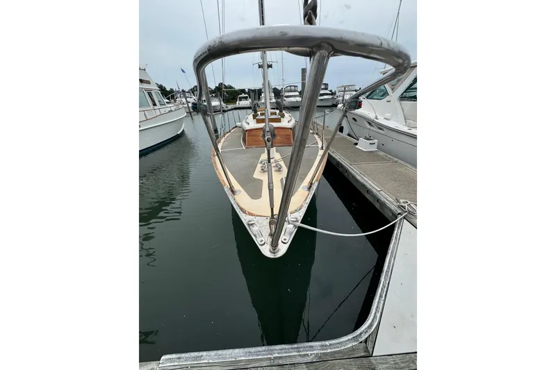 Slide: The Image of 1960 Alden Challenger 38 sailboat docked at marina, viewed from bow. - 6