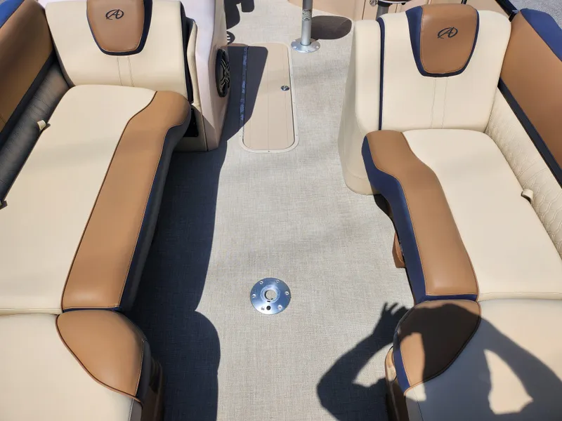 Slide: The Image of Luxurious seating on 2021 Avalon Catalina Platinum Entertainer Funship boat, featuring beige and brown upholstery. - 13