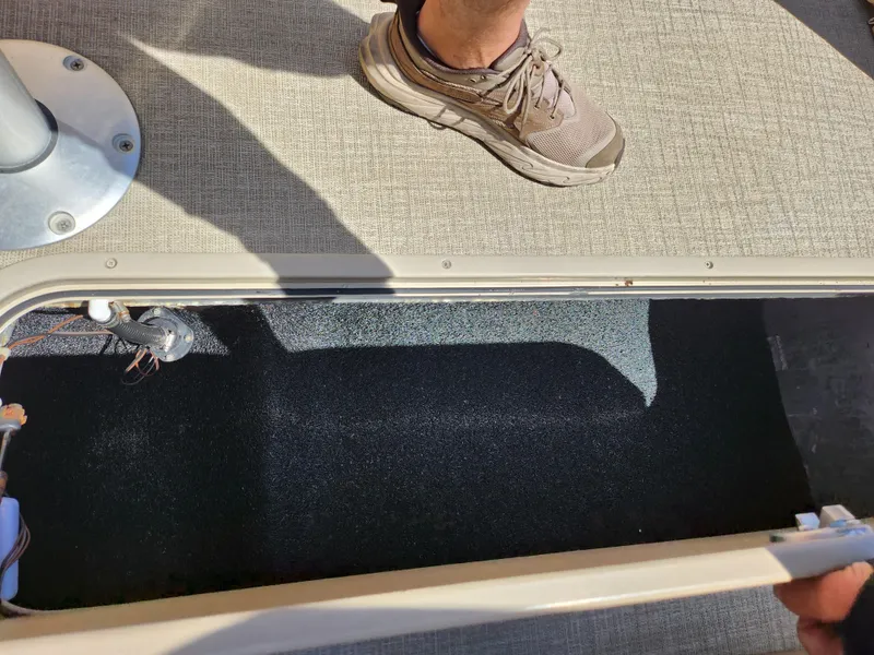 Slide: The Image of 2021 Avalon Catalina Platinum Entertainer Funship interior storage compartment with carpeted flooring. - 27