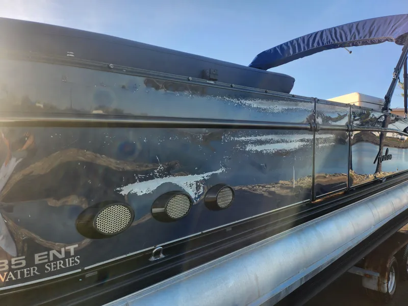 Slide: The Image of 2021 Avalon Catalina Platinum Entertainer Funship boat, side view with visible wear and scratches. - 6