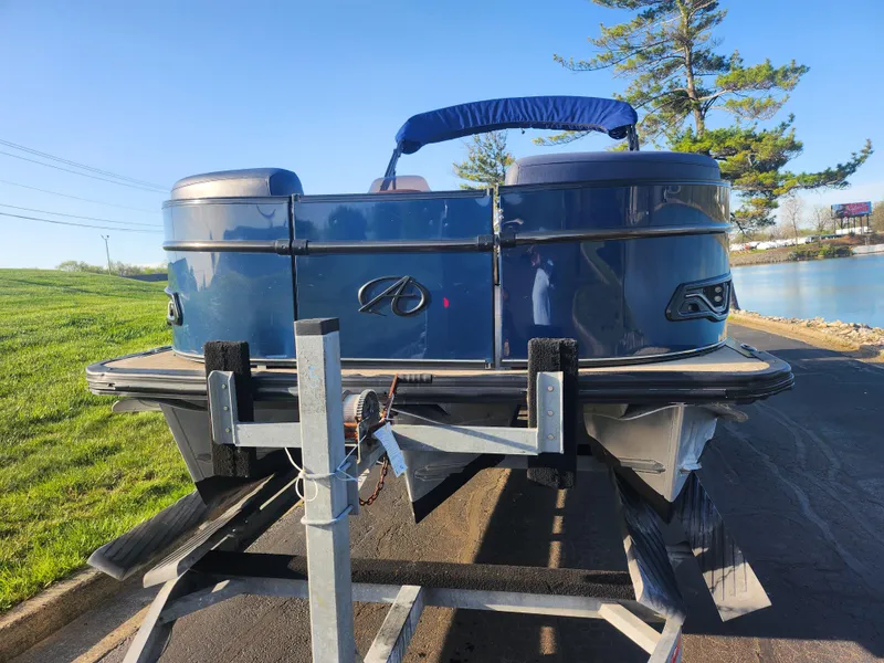 Slide: The Image of 2021 Avalon Catalina Platinum Entertainer Funship on trailer by a lake. - 7