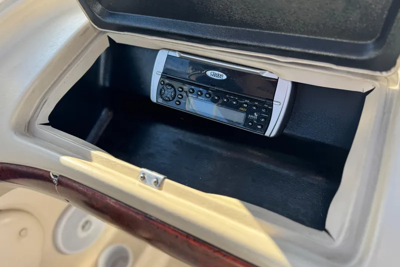 Slide: The Image of 2004 Glastron GX 235 boat dashboard with Clarion stereo system. - 18