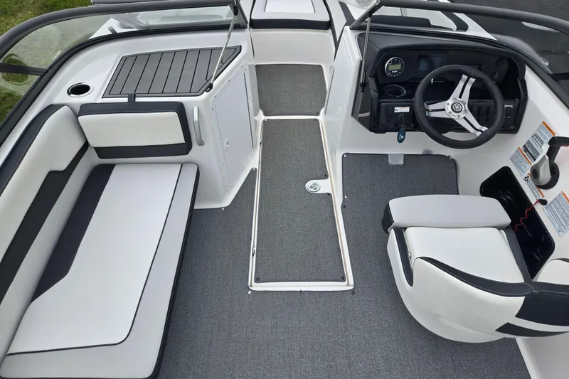 Slide: The Image of 2019 Yamaha Boats AR195 interior with sleek seating and modern dashboard design. - 12