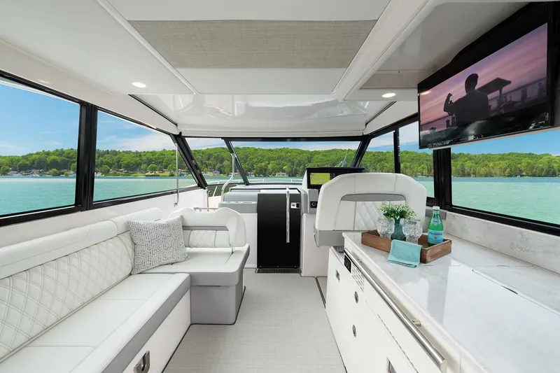 Slide: The Image of Manufacturer Provided Image: Luxurious interior of 2025 Regal 36 XO yacht with modern seating and scenic views. - 12