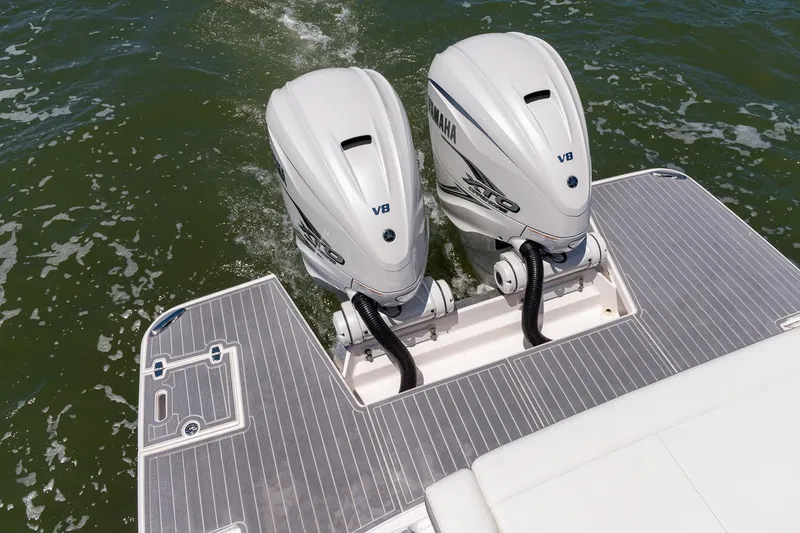 Slide: The Image of Manufacturer Provided Image: 2025 Regal 36 XO boat with twin Yamaha V8 outboard engines on water. - 3