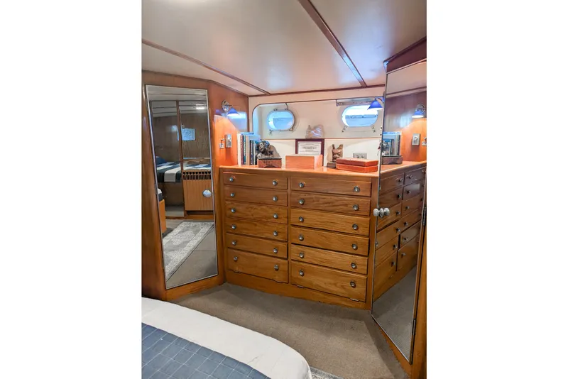 Slide: The Image of Wooden interior of a 1954 Grebe Sedan with drawers, mirrors, and nautical decor. - 17