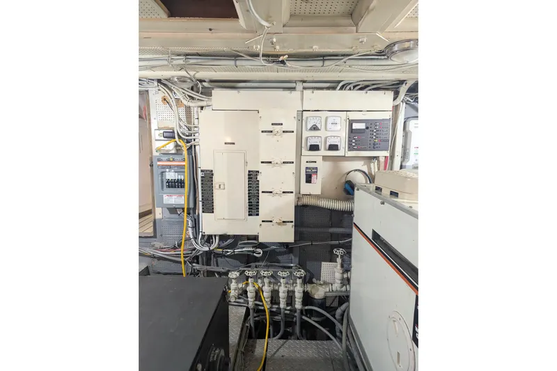 Slide: The Image of Electrical control room with panels and wiring, related to a 1954 Grebe Sedan. - 33