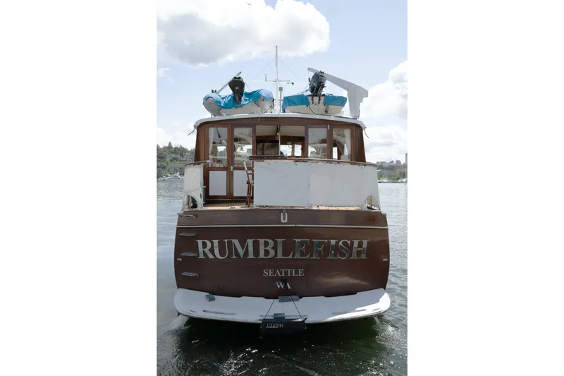 Slide: The Image of Rear view of the boat "Rumblefish" on water, Seattle, under a cloudy sky. - 35