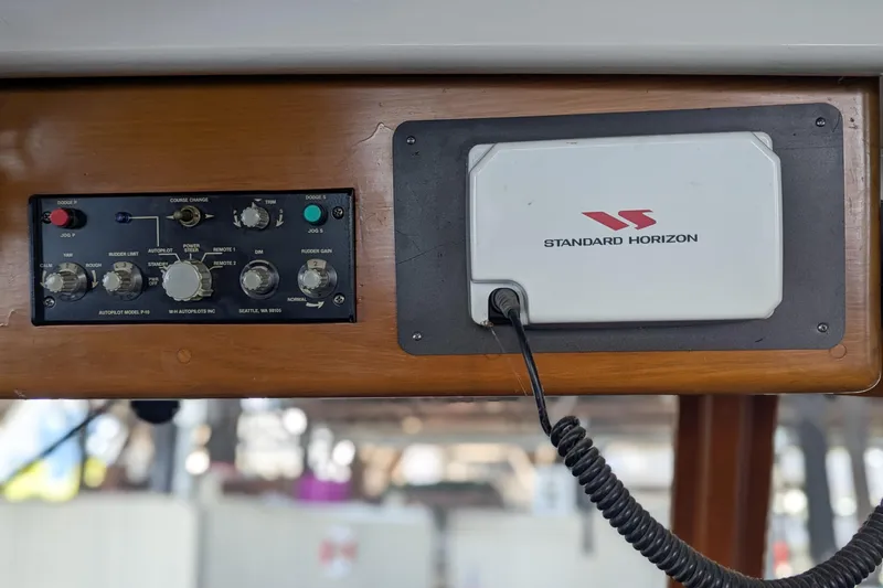 Slide: The Image of 1954 Grebe Sedan dashboard with Standard Horizon device and autopilot controls. - 7