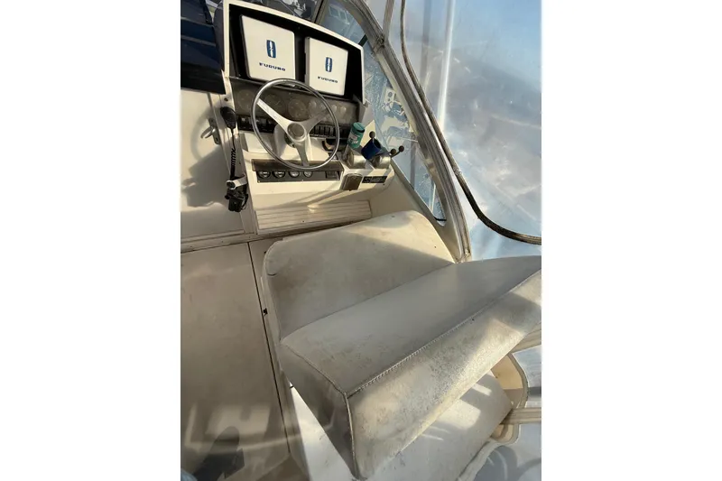 Slide: The Image of Interior view of 1995 Blackfin 31 Combi boat cockpit with steering wheel and navigation screens. - 12