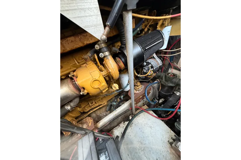 Slide: The Image of Engine compartment of a 1995 Blackfin 31 Combi boat, showing mechanical components. - 15