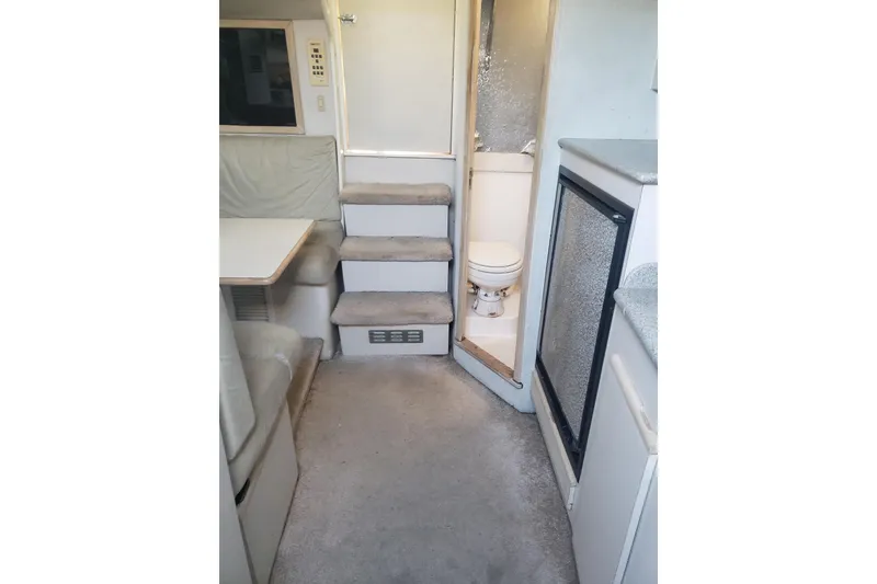 Slide: The Image of Interior of 1995 Blackfin 31 Combi boat with seating, stairs, and compact bathroom. - 20