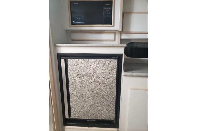 Slide: The Image of Interior of 1995 Blackfin 31 Combi boat with microwave and compact fridge. - 21