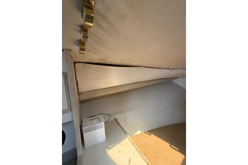 Slide: The Image of Interior view of 1995 Blackfin 31 Combi boat cabin with storage and equipment. - 25