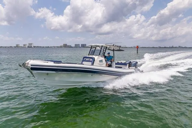 Slide: The Image of 2018 RIB CVL Colt 35 cruising on open ocean under clear blue sky. - 0