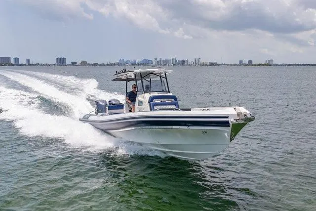 Slide: The Image of 2018 RIB CVL Colt 35 cruising on open sea under cloudy sky. - 1