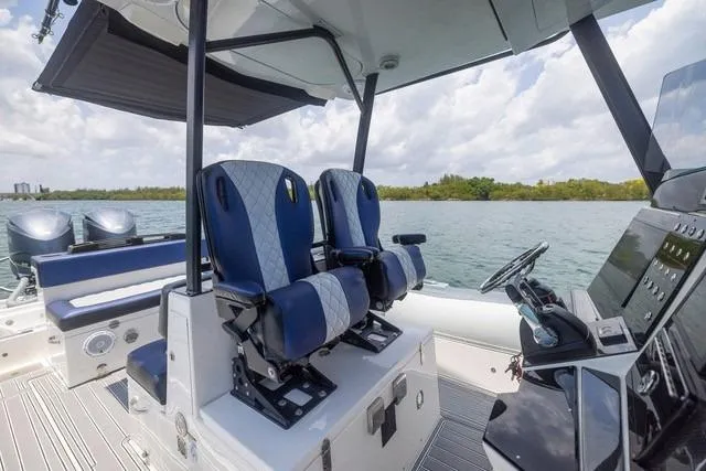 Slide: The Image of 2018 RIB CVL Colt 35 boat docked in marina under blue sky. - 10