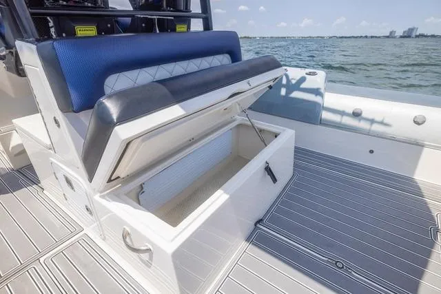 Slide: The Image of 2018 RIB CVL Colt 35 boat docked with dual Yamaha engines, clear sky background. - 16