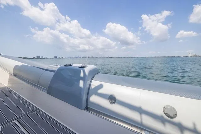 Slide: The Image of 2018 RIB CVL Colt 35 boat with dual Yamaha outboard motors docked at marina. - 18