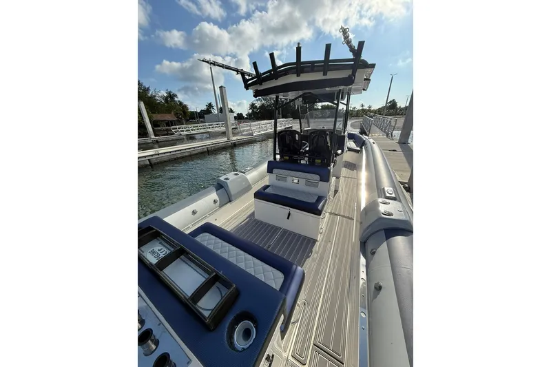 Slide: The Image of 2018 RIB CVL Colt 35 boat docked, featuring sleek design and modern seating. - 24