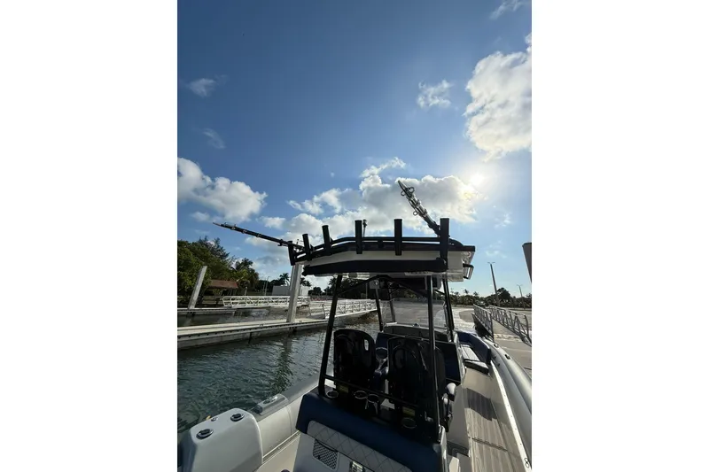 Slide: The Image of RIB CVL Colt 35 boat docked under a sunny sky, 2018 model. - 25