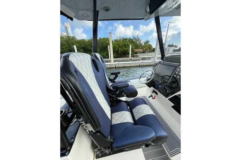 Slide: The Image of Interior of 2018 RIB CVL Colt 35 boat with blue and white seating. - 31