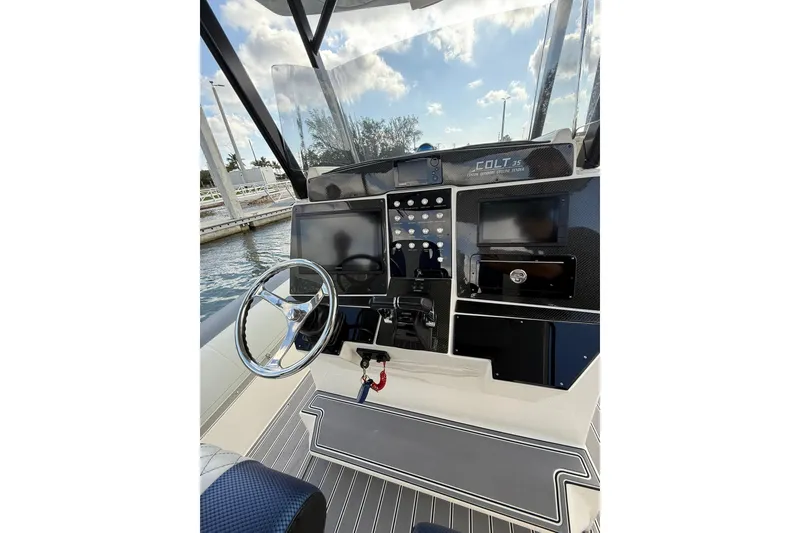 Slide: The Image of 2018 RIB CVL Colt 35 boat dashboard with steering wheel and control panel. - 33