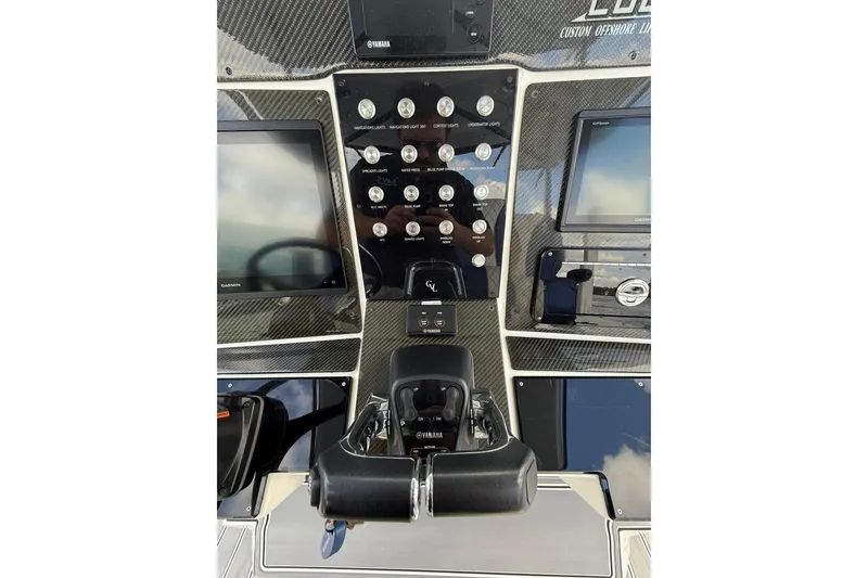 Slide: The Image of Control panel of 2018 RIB CVL Colt 35 with navigation screens and switches. - 34