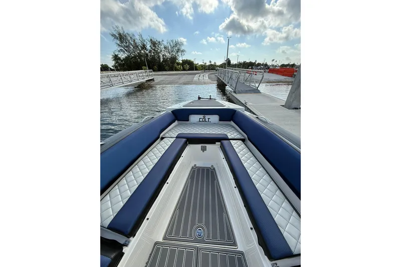 Slide: The Image of RIB CVL Colt 35 boat interior, 2018 model, docked with blue and white seating. - 41