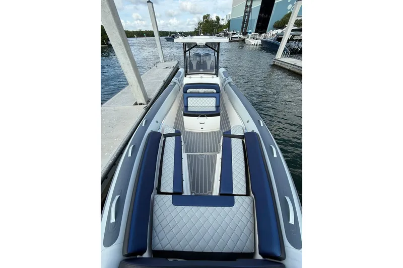 Slide: The Image of 2018 RIB CVL Colt 35 boat docked, featuring sleek seating and modern design. - 44