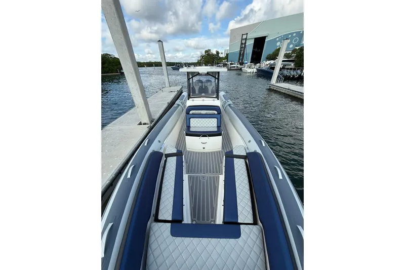 Slide: The Image of 2018 RIB CVL Colt 35 boat docked at marina, featuring sleek design and spacious seating. - 45