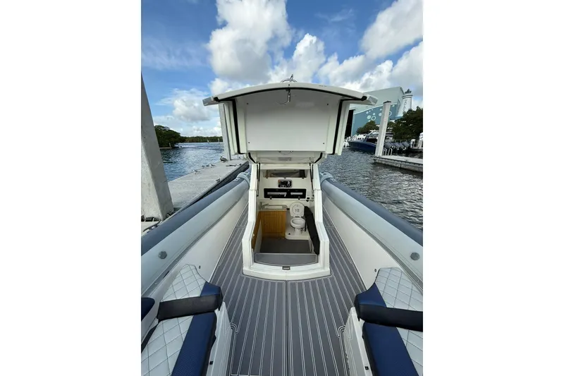 Slide: The Image of 2018 RIB CVL Colt 35 boat interior with open cabin and water view. - 49